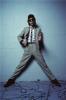 ric ocasek the cars standing agianst a  wall legs speras pointing at camera LOS ANGELES, 1982